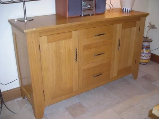 A timber sideboard with drawers and cabinet doors.