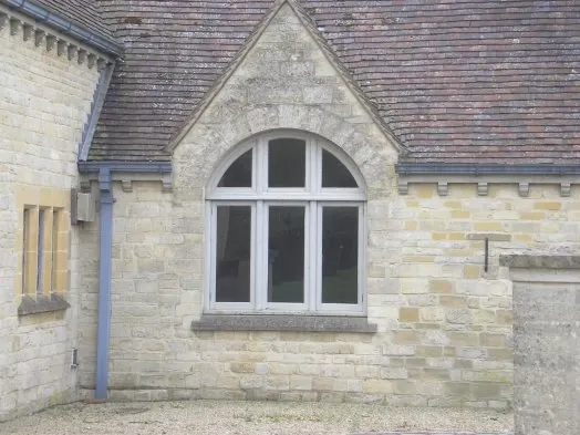 A window in a stone cottage wall.