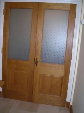 A timber interior door with glazed panels.