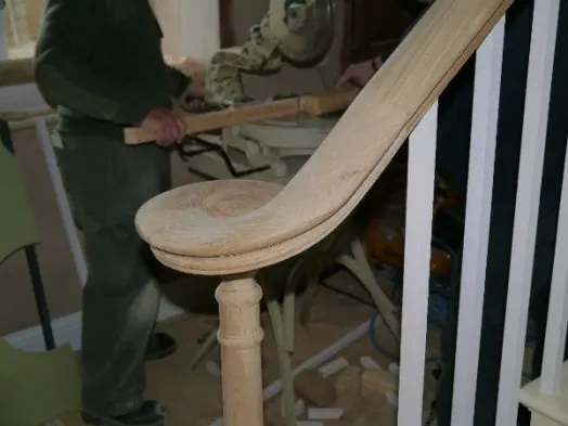 A staircase component being prepared in a workshop.