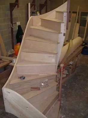 A timber staircase in a domestic interior.