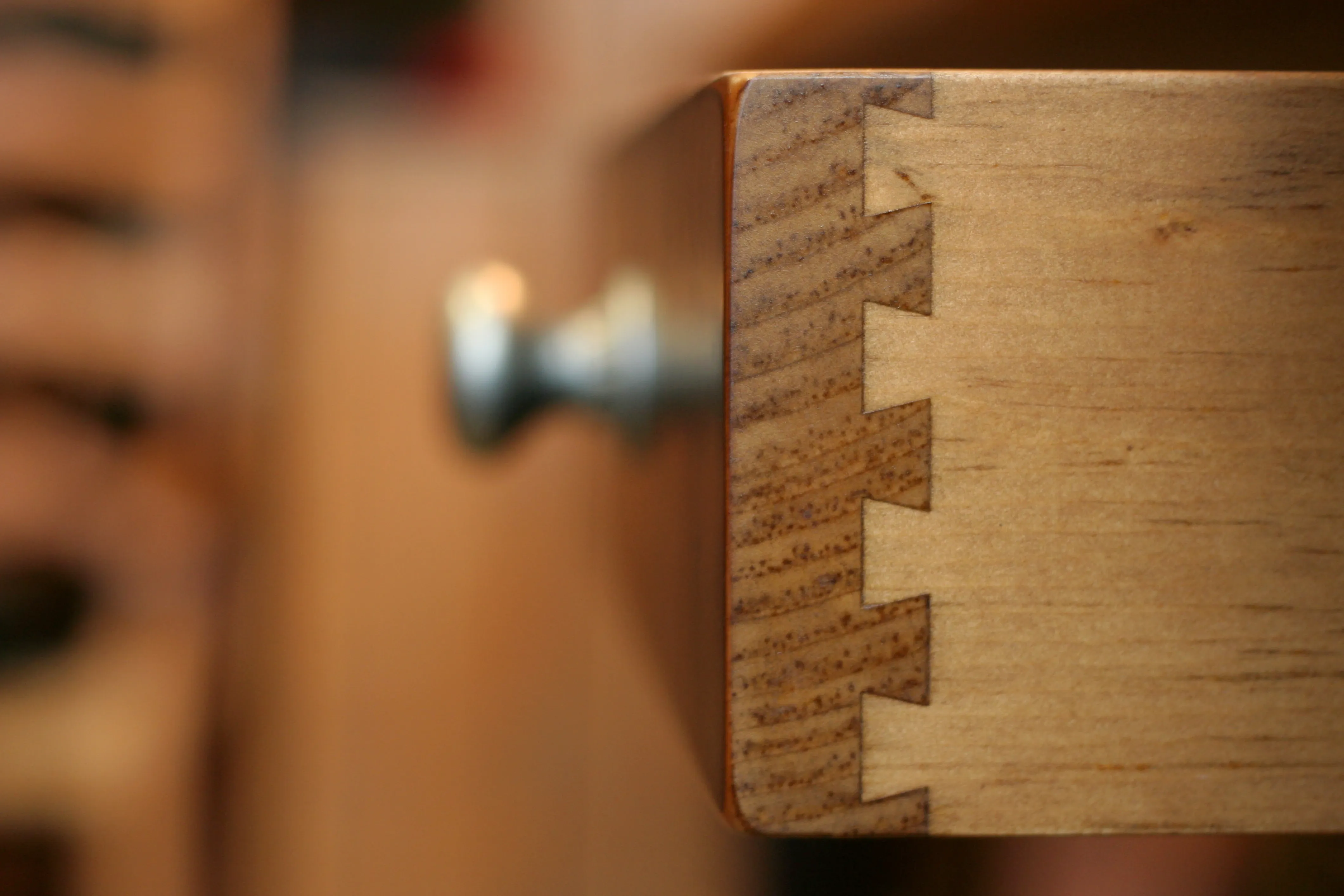 A close-up of a timber joint and grain detail.