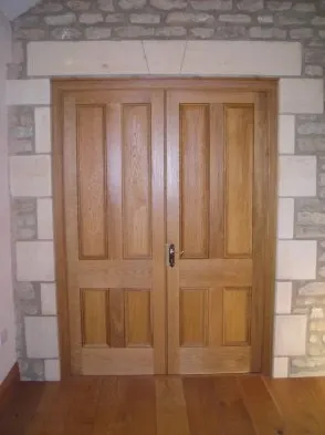A timber panel door viewed from the room.