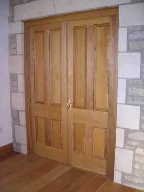 A traditional timber door with raised panels.
